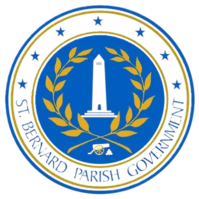 The image shows the official seal of the St. Bernard Parish Government, featuring a central lighthouse, surrounded by a golden laurel wreath, a blue background, and stars around the wreath.