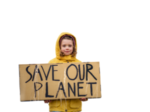 A child wearing a yellow coat holds a cardboard sign with the words "SAVE OUR PLANET" written in large black letters.